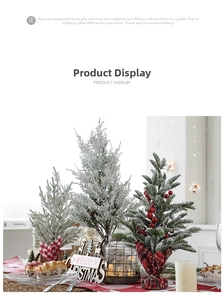 Mini frosted Christmas trees with red berries and merry christmas sign for tabletop