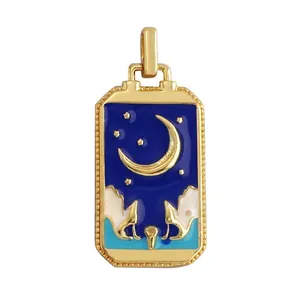 Detail of tarot moon and stars pendant in blue enamel with gold plated brass edge