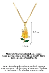 Macro detail of tulip pendant with yellow pear-shaped zircon and green stone leaves