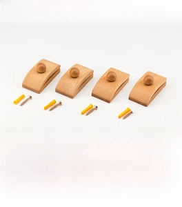 Detailed view of 4 beechwood wall clips with included mounting screws and expansion tubes