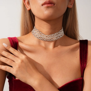 Close-up of sparkling silver geometric mesh choker necklace with crystal rhinestones