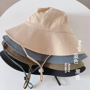 Close-up of lightweight textured sun hats with adjustable windproof drawstrings in four colors