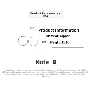 Detailed specs of 6cm silver twisted hoop earrings made of copper weighing 12.3g