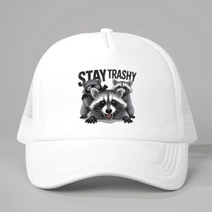 Close-up of Stay Trashy raccoon print and mesh texture on white trucker hat