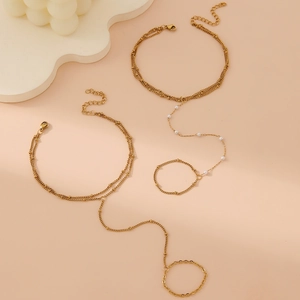 Gold layered slave bracelet with imitation pearls and finger ring for women accessory