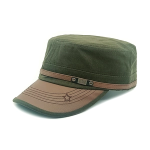 Detail of army green canvas flat top cap with brown faux leather brim and metal FS tag