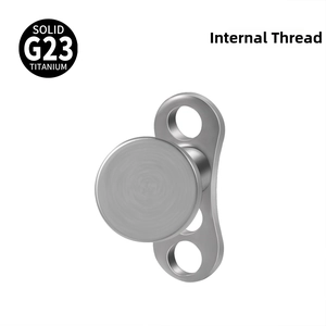 Macro detail of internally threaded G23 titanium dermal anchor with base and round top
