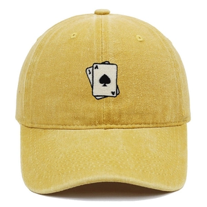 Close-up of Ace of Spades embroidery on yellow washed cotton vintage baseball cap