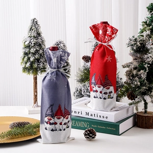 Christmas gnome wine bottle gift bags set in red and grey fabric for festive table decor