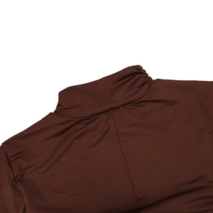 Detail of high neck design and soft ribbed fabric texture on dark brown mini dress