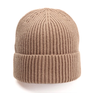 Detailed close-up of ribbed texture and folded cuff on a tan knitted beanie hat