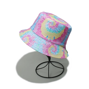 Detail of colorful tie-dye bucket hat with pink, yellow and blue swirl patterns