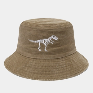 Detailed white dinosaur skeleton embroidery on washed cotton earth-tone bucket hat