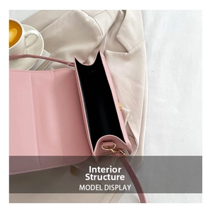Detailed interior view of a pink PU leather crossbody bag with single compartment