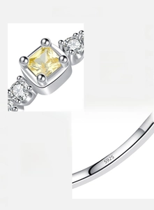 Macro view of S925 sterling silver ring featuring yellow cushion-cut zirconia stone