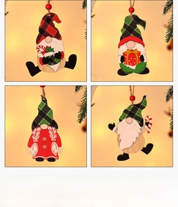 Set of four wooden Christmas gnomes with plaid hats and hanging cords for tree decoration