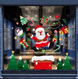 Detailed Christmas window stickers showing Santa Claus, snow house, and trees on glass
