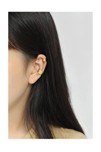 Close-up of golden textured irregular ear cuff and minimalist double line ear clip set