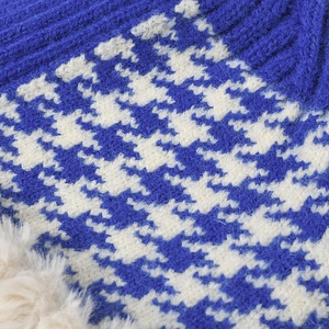 Women's outdoor knit bucket hat with blue and white houndstooth pattern and fleece detail
