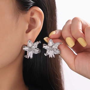 Elegant silver lily flower earrings with white pearl stamens and 18k gold plating