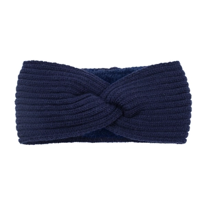Detail of navy blue knitted headband with thick wool texture and elegant cross knot design
