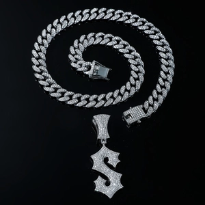 Silver iced out Cuban chain necklace with a rhinestone encrusted dollar sign pendant