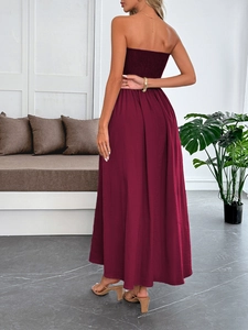 Back view of wine red strapless maxi dress showing elegant drape and silhouette