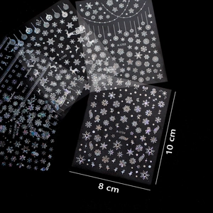 Holographic winter nail stickers featuring snowflakes and reindeer patterns in five designs