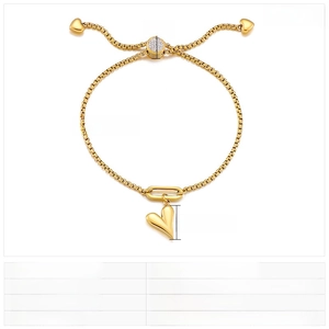 Macro shot of adjustable gold heart bracelet showing size specs and rhinestone details