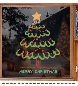 Christmas tree window sticker with red stars and Merry Christmas text on glass