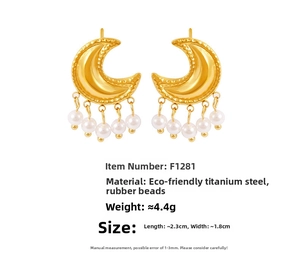 Detailed view of moon-shaped earrings with white pearls and structured gold texture