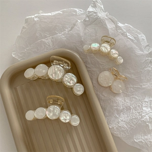 Elegant acrylic pearl claw clips in various sizes for hair styling and accessories