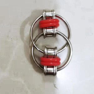 Macro shot of silver fidget flippy chain with red silicone O-rings for stress relief