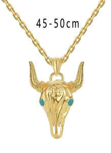 Detail of a golden bull skull pendant with turquoise eyes and 45-50cm chain length