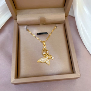 Elegant gold butterfly pendant necklace with cubic zirconia in a jewelry gift box
