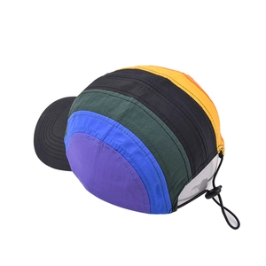 Detail of multi-color block five-panel baseball cap with adjustable rear bungee cord