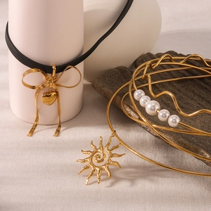 Chic 18K gold-plated choker necklace set featuring bow, heart, and sun charms with pearls