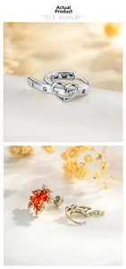 Details des orangefarbenen Ahornblatt-Ohrrings mit Kristallen und silbernem Herzring