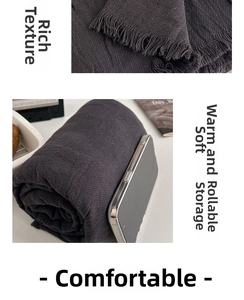 Detailed texture of charcoal grey meditation shawl with soft fabric and fringe edges