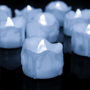 Detail of blue LED tea lights with realistic melted wax edge effect for party decor