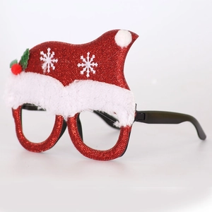 Detail of red glitter Santa hat glasses with white plush trim and festive holly leaf accents