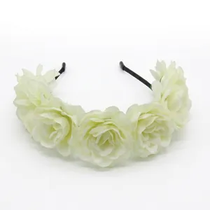 Detail of white fabric rose flower crown with layered silk petals for bridal photography