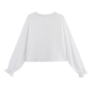 White embroidered hollow-out blouse with long ruffled sleeves and pleated texture