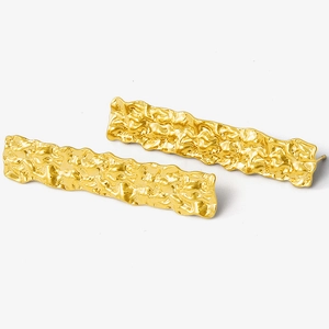 Macro shot of gold-plated 304 stainless steel earrings with unique wrinkled metal texture