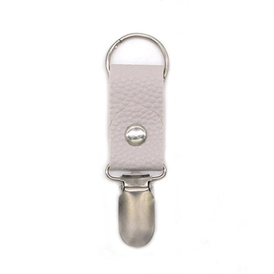 Detail of lavender litchi leather hat clip with silver metal ring and duckbill clamp