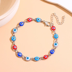 Detail of Turkish Evil Eye bracelet with multi-colored charms and adjustable silver chain