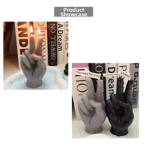 Detail of grey and black victory hand gesture scented candles with dual cotton wicks