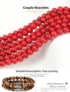 Detail of beaded bracelets with tiger eye, red stones, owl and Buddha alloy charms