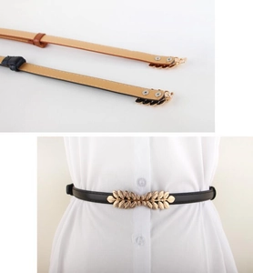 Detail of thin PU leather belts with golden leaf buckle in black and khaki colors