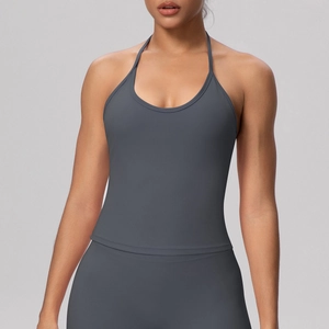Detailed back view of dark grey halter yoga top showing seamless strappy design and texture